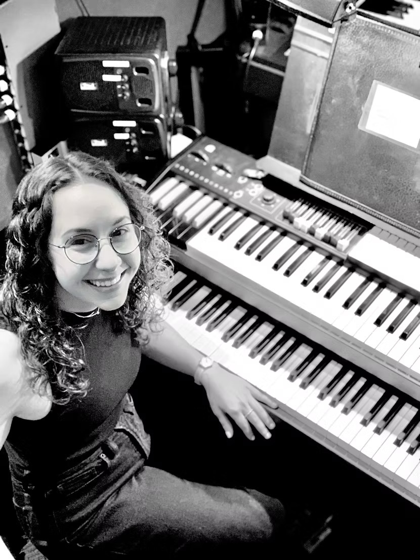 Marika Countouris seated at a bank of keyboards